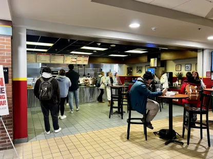 Students waiting in line at Fieras to order. You can see tables and an overview of the restaurant.