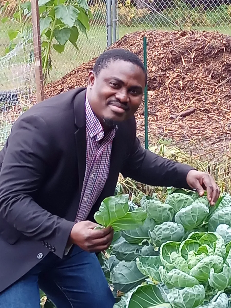 Dr. Adebiyi in a garden