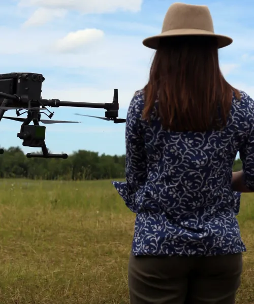 Student flying drone at Seeds and Spores Farm