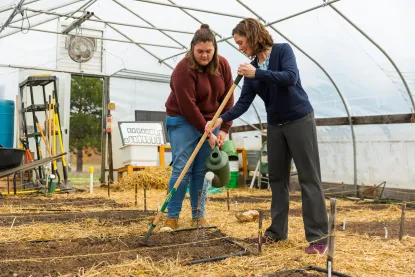 Dr. Susy Ziegler and Freshman Fellow in NMU Hoop House