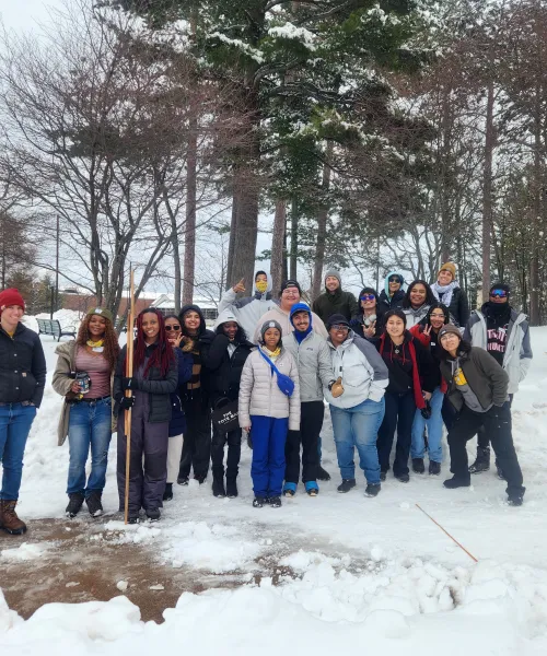 Students posing outside during the winter. 