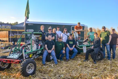 The 2025 NMU Baja Racing Team poses together at the Backwoods Baja Race in Wisconsin