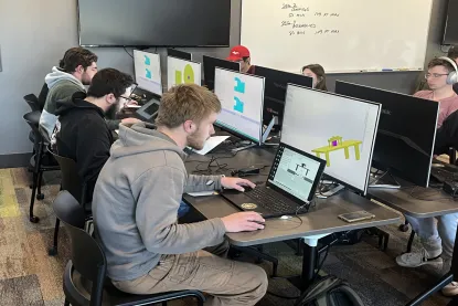 Students working on design assignment in the CAD lab.