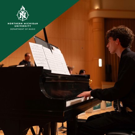 Northern Michigan University pianist performs at a grand piano from sheet music in a warm concert hall, creating a focused, elegant mood.