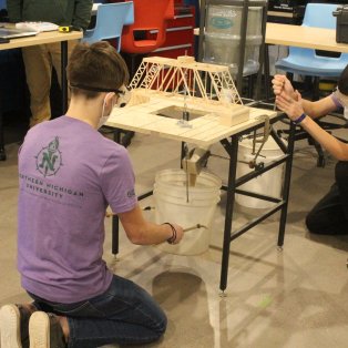 high school students competing at science olympiad event