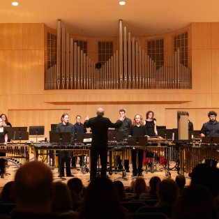 Dr. James A Strain directing the percussion ensemble