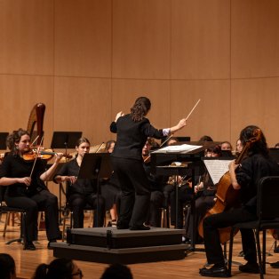 Dr. Barbara Rhyneer conducting the 2023 NMU Orchestra