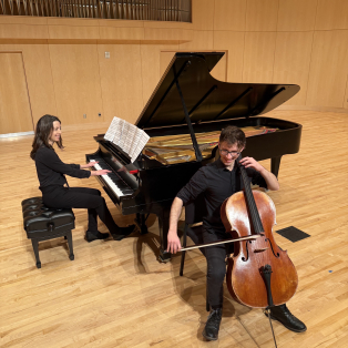 Theresa Camilli (NMU faculty) playing the piano with cellist, Adam Hall 