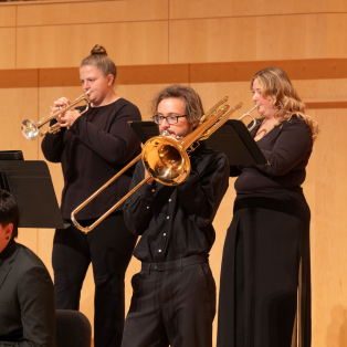 Erik performing in the Fall 2025 jazz concert with his trombone