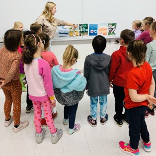 nmu student leading discussion with young students