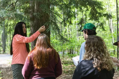 Native American Studies professor teaching about a tree
