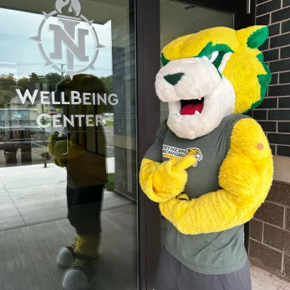 Wildcat Willy mascot with a bandaid from a flu shot