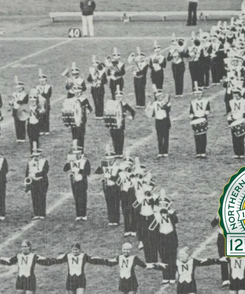 Vintage black and white photo of the Northern Michigan University marching band on the field