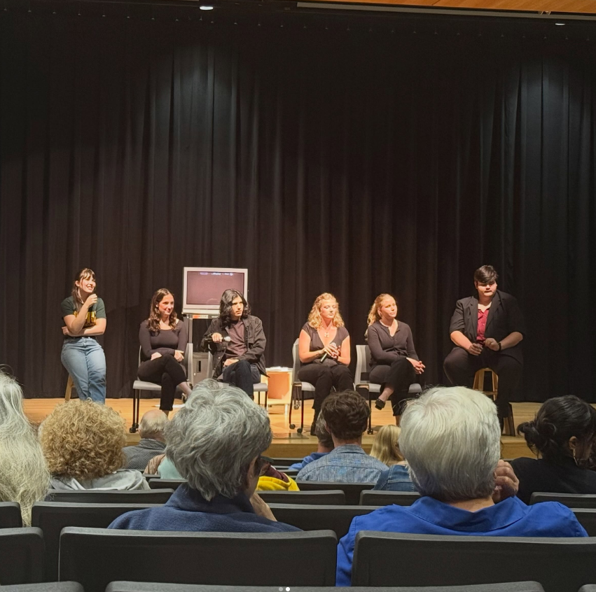 Six actors sitting in chairs on-stage at the performance of Find a TV in September 2026. Photo from the Found Space Theater Company Instagram.