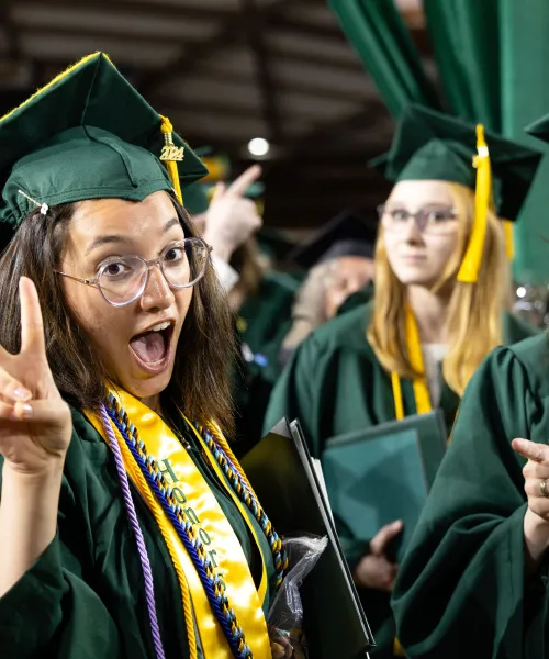 Honors Program Graduates posing at Commencement