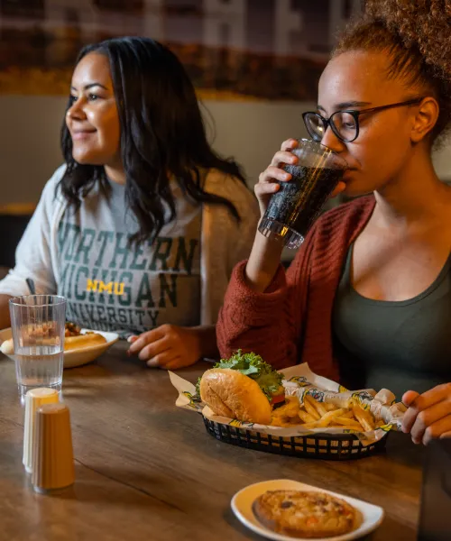 Two students eating at Northern Lights Dining