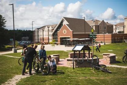 Students setting up their bike outside of the Lodge