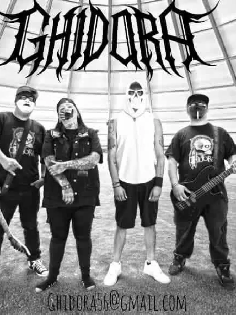 four band members for Ghidora standing iconically with instruments