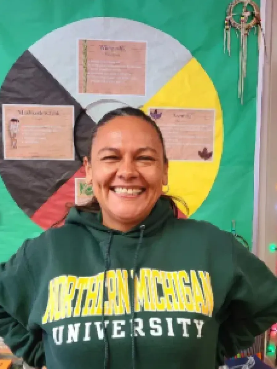 Dr. Pucan wearing a NMU sweater