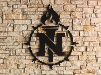 NMU torch insignia on brick wall