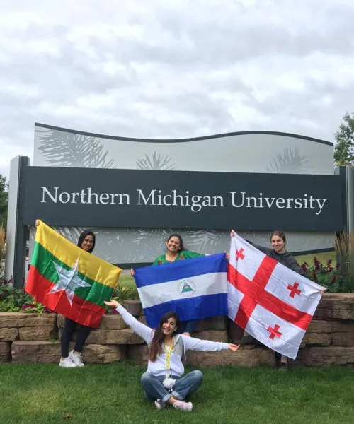 4 International Students by NMU sign 