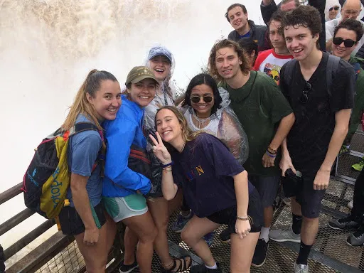 Group of students by a waterfall in Argentina