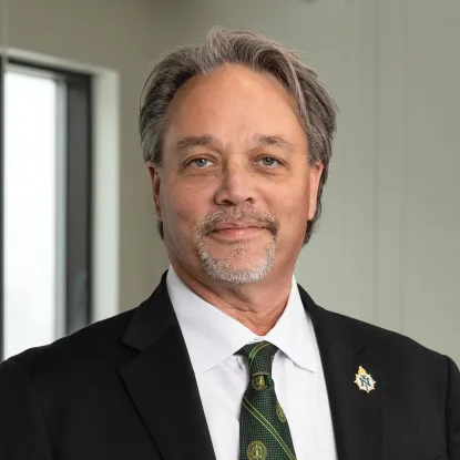 Headshot of NMU President Chris Olsen