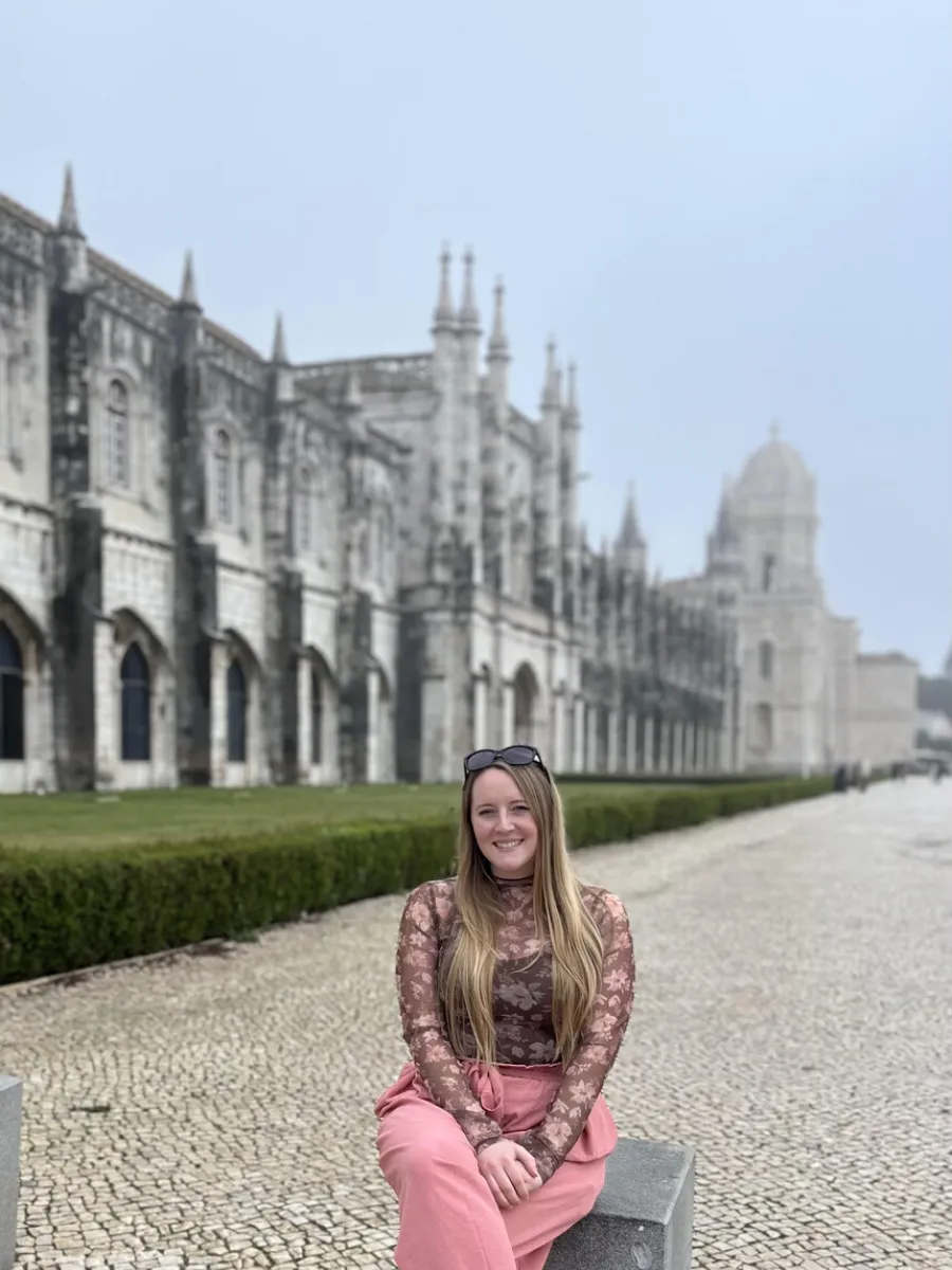 Nicole Hoffman Sitting Near a Castle