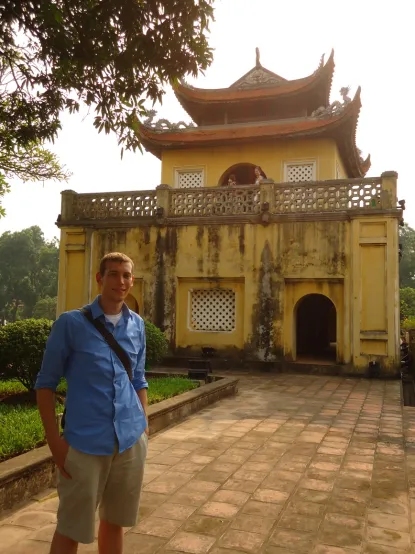 Karl in front of a building in Cambodia