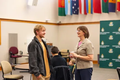 Dr. Ulland speaking to student