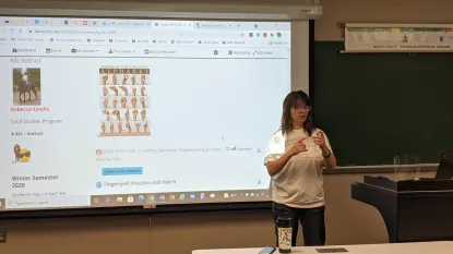 Professor Estelle fingerspelling with workshop participants