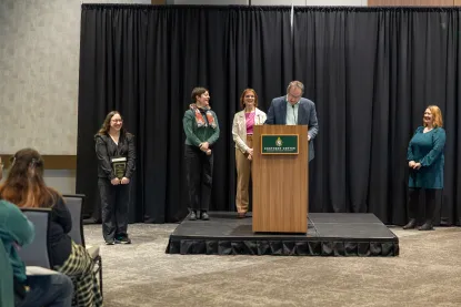 Sam Marier receiving award