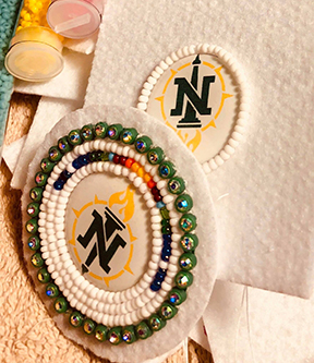 Beaded NMU logo