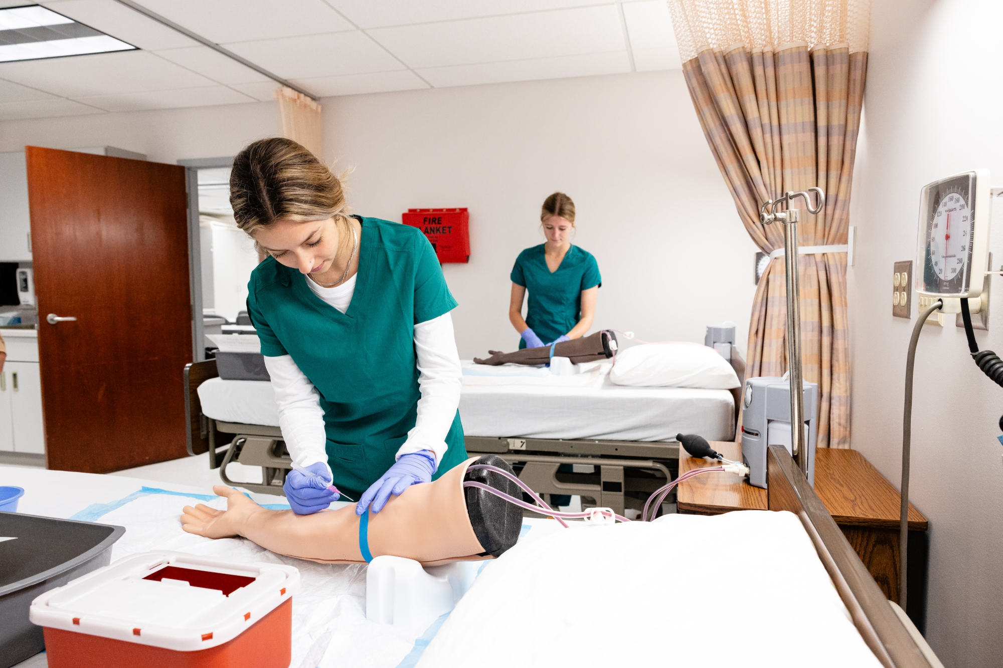 Nursing students work in the phlebotomy simulation lab at NMU