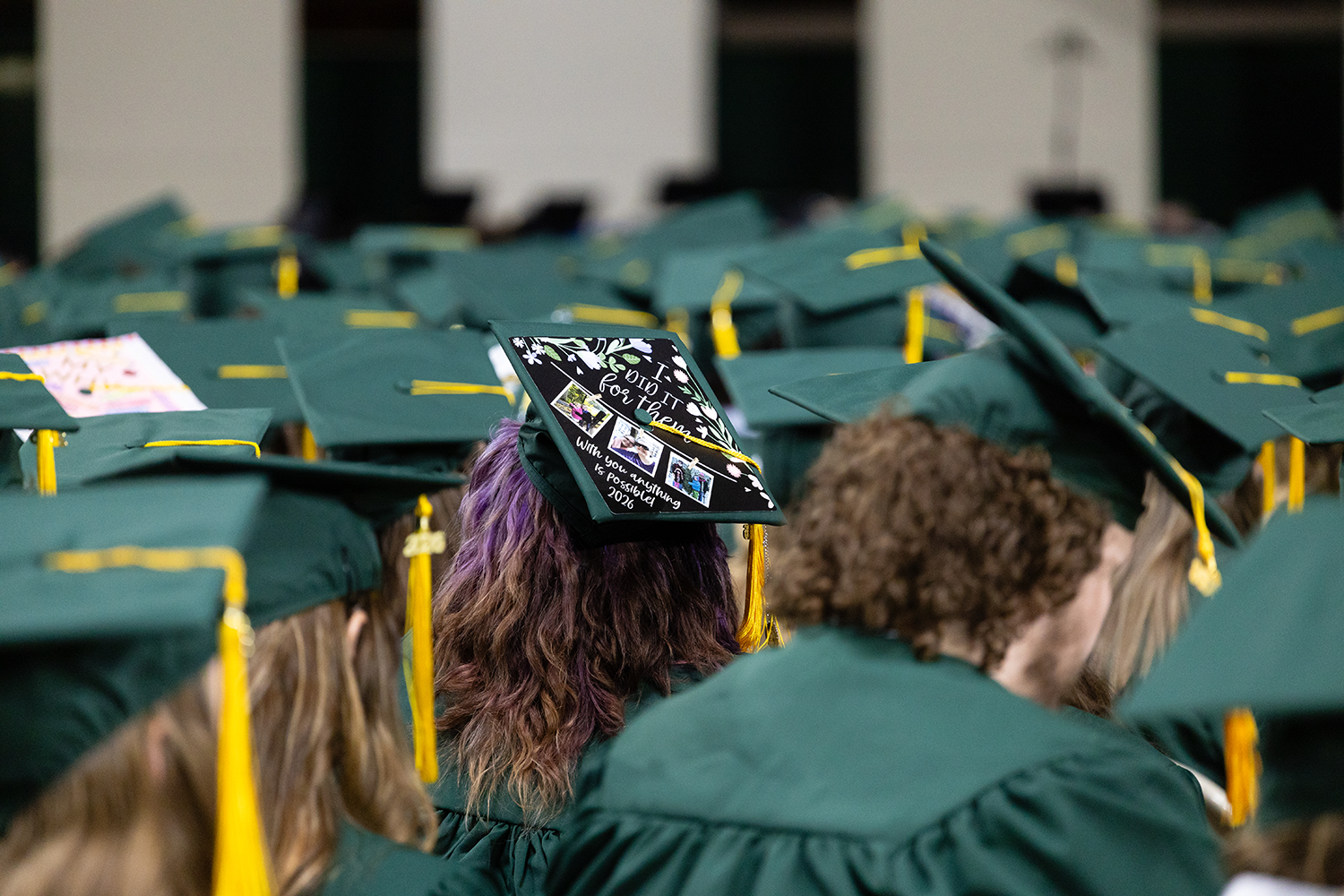 NMU students wearing caps and gowns at the spring 2026 commencement ceremony.