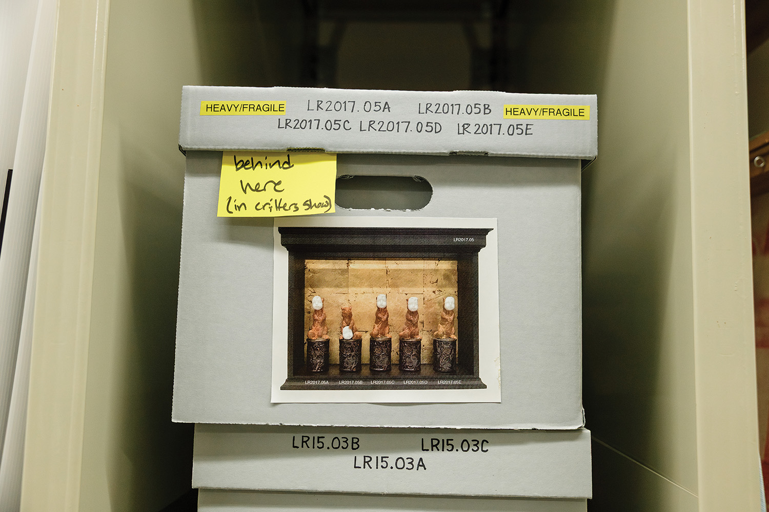 Box labeled with reference number and image of contents