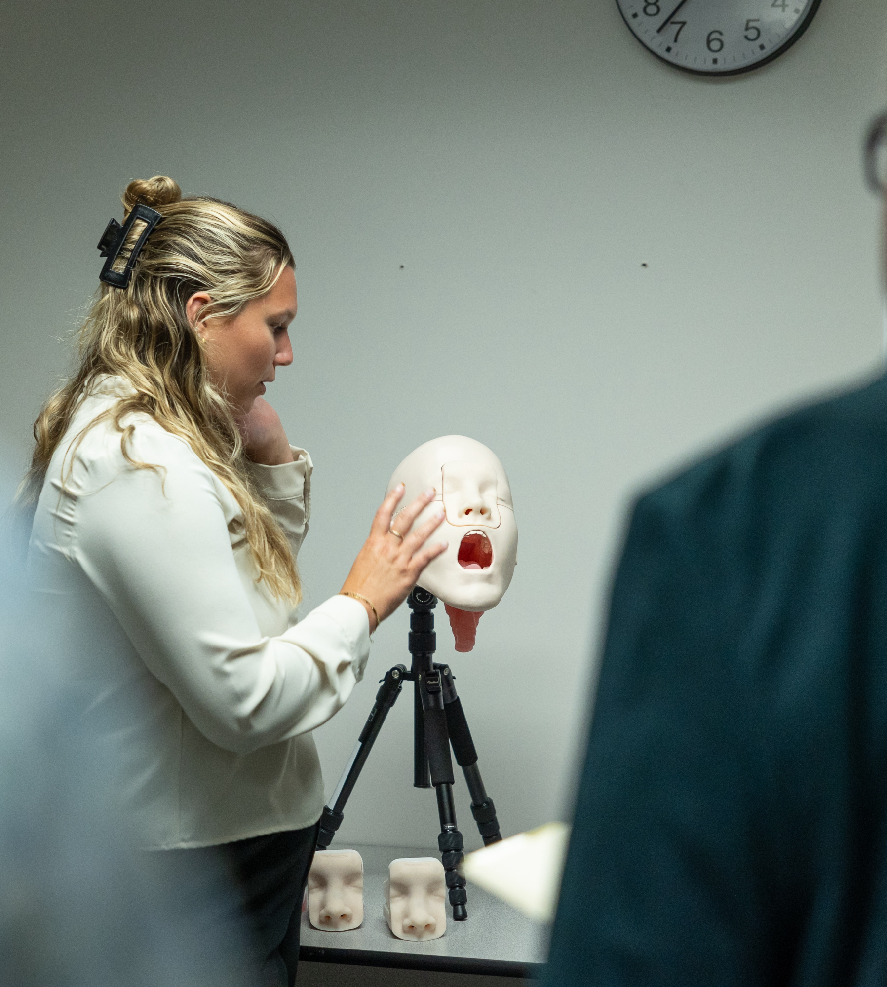 A Speech, Language, Hearing science student showcasing new swallow equipment