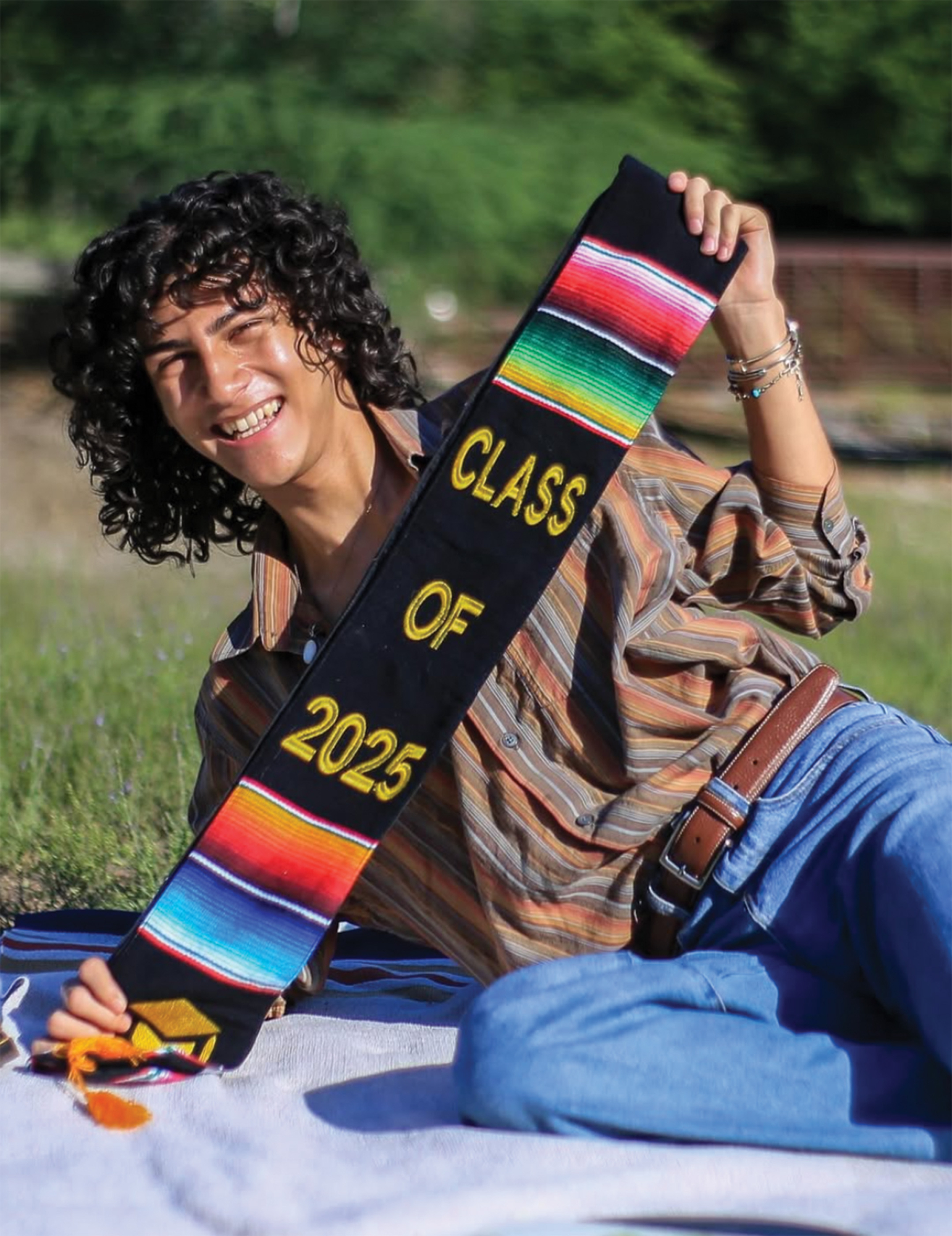 Schultz fellow Sebastian Taveres poses with his Class of 2025 highschool sash