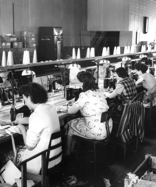 Lines of women on a sewing line in the 1940s