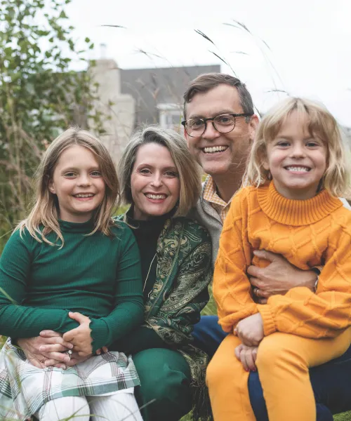 Brock and Kristin Tessman with daughters outside on NMU's campus