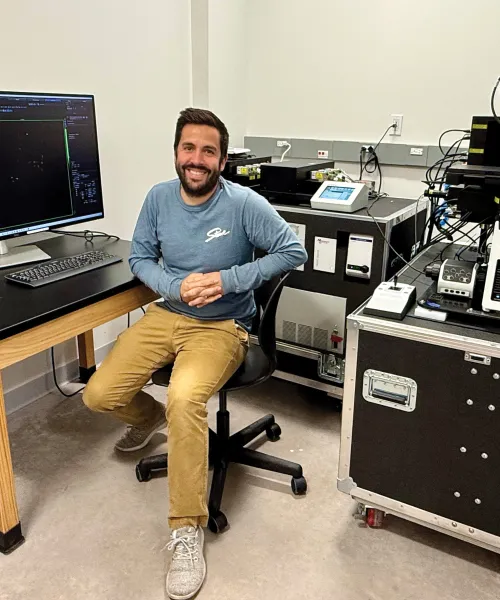 Danny LeBert sitting in the Microscopy Suite's room.
