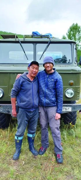 NMU Biology Professor Kurt Galbreath with Mongolian colleague Buyaa, who kept the crew going by driving the Soviet-era GAZ-66 field vehicle seen in the background.