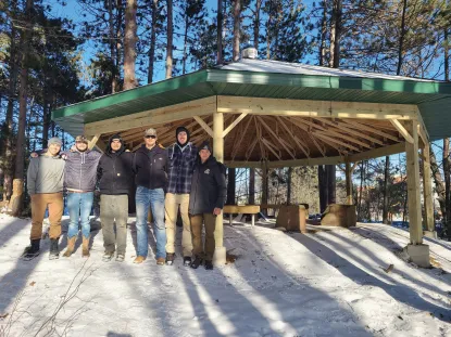 NMU Construction Management students stand outside the outdoor learning area