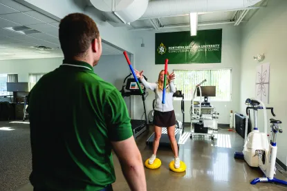 Students work on a physical, cognitive exercise