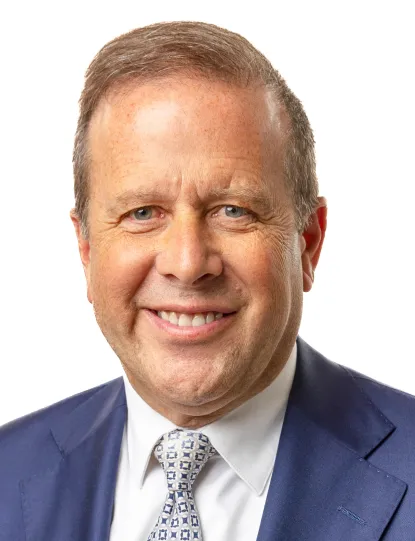 Headshot of Gavin Leach.