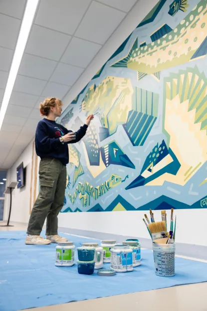 Sydney Kuipers painting her mural.