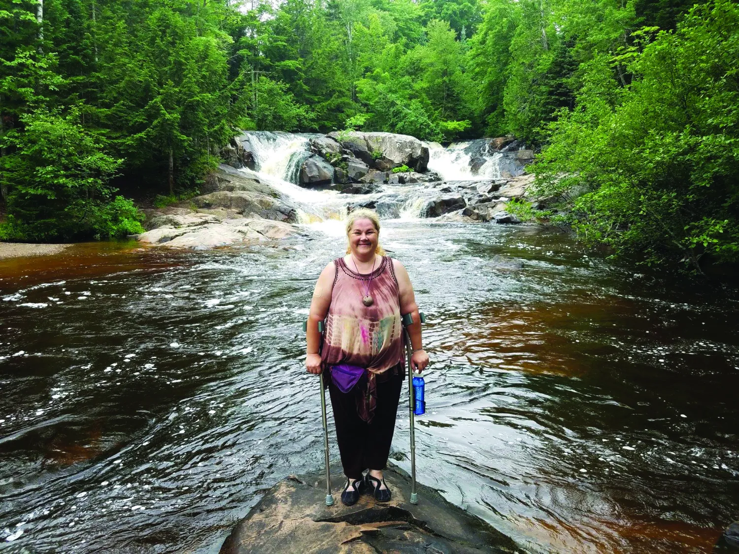 Tina standing in a river