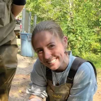 Emilee Goach smiling outdoors. 