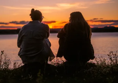 Two students at Presque Isle during the sunset