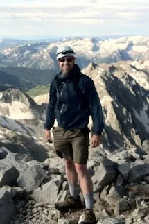 Photograph of Sean Peecher climbing mountains.